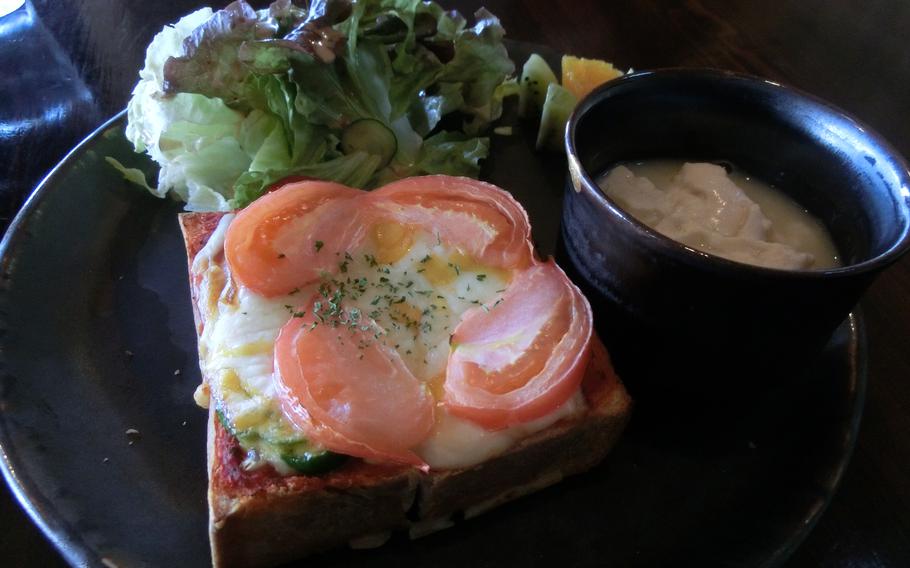 Limited plate (set A). The pizza toast, yushidohu, a small salad, and fruit on a plate.